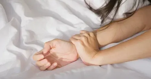Man hand holding a woman hand for rape and sexual abuse or domestic violence concept