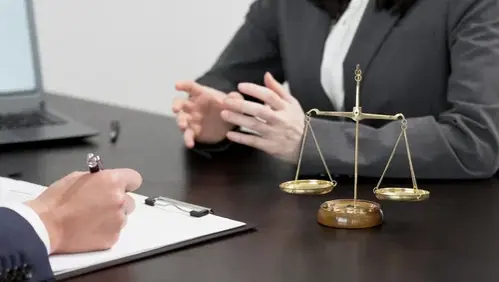 The hands of a lawyer receiving consultation on a problem