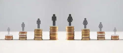 Coins with a Gender pay gap inequality concept.
